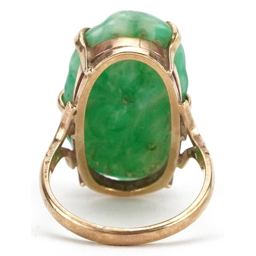 2142 - 9ct gold Chinese carved green jadeite ring, size O, 8.0g