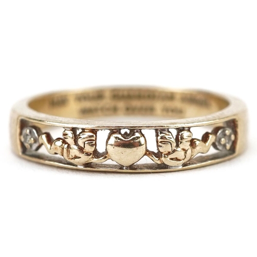 2574 - 9ct gold diamond ring pierced a love heart and putti, engraved May Your Guardian Angel Watch Over Yo... 