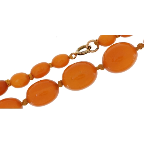 2024 - Butterscotch amber coloured graduated bead necklace, the largest bead approximately 19mm x 15mm, ove... 