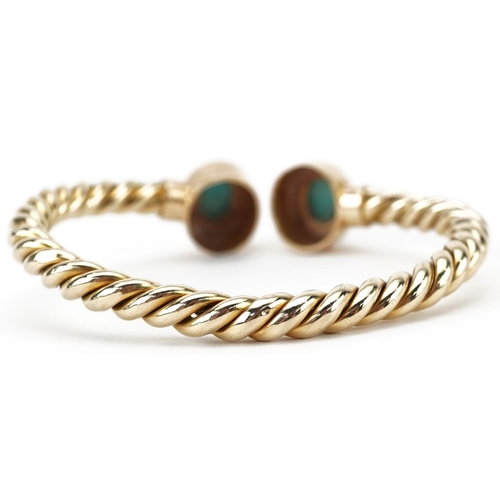 2056 - Unmarked gold rope twist and cabochon turquoise bangle, tests as 15ct gold, 6.5cm wide, 13.5g