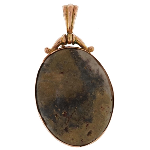 2197 - 9ct gold pendant set with a hardstone cabochon, 4.5cm high, 10.5g