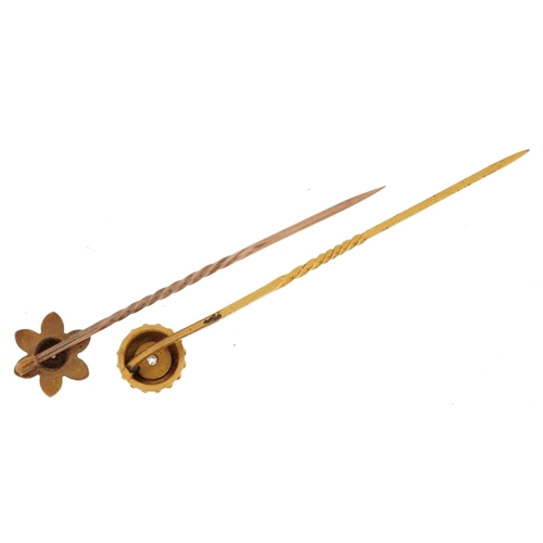 2516 - Two unmarked gold and yellow metal diamond solitaire stickpins, one marked 15ct, the other unmarked,... 