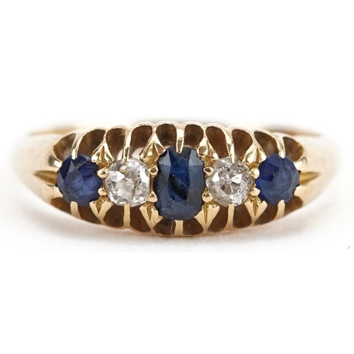 2216 - 18ct gold diamond and sapphire five stone ring with pierced setting, the largest sapphire approximat... 