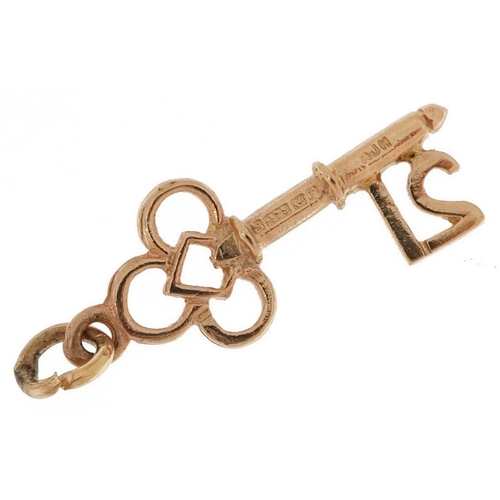 2630 - 9ct gold 21st birthday key charm, 2.1cm in length, 0.8g