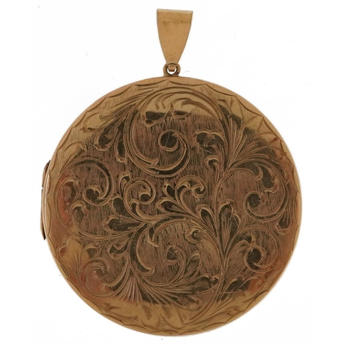 2530 - Large 9ct gold floral engraved circular locket, 6cm high, 21.2g