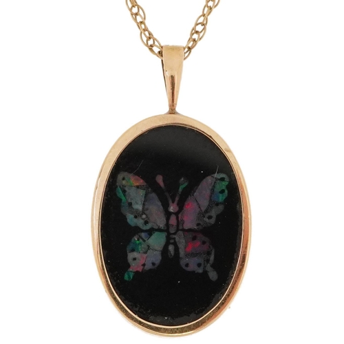 2455 - 9ct gold black onyx and opal butterfly pendant on a 9ct gold necklace, 2.5cm high and 40cm in length... 