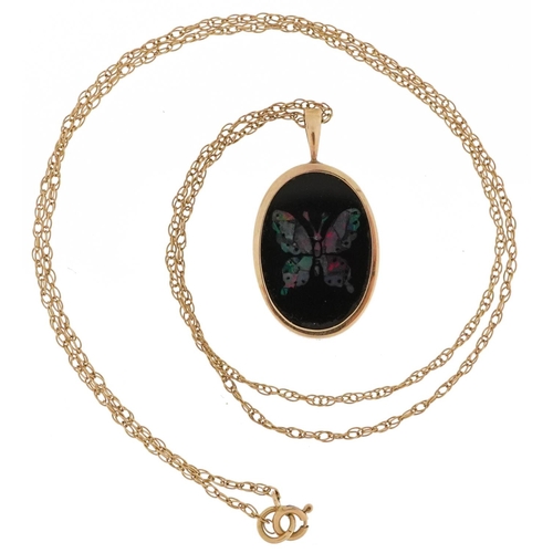 2455 - 9ct gold black onyx and opal butterfly pendant on a 9ct gold necklace, 2.5cm high and 40cm in length... 