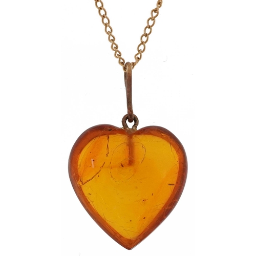 2088 - Natural amber love heart pendant on a 9ct gold necklace, 2cm high and 44cm in length, total 2.0g