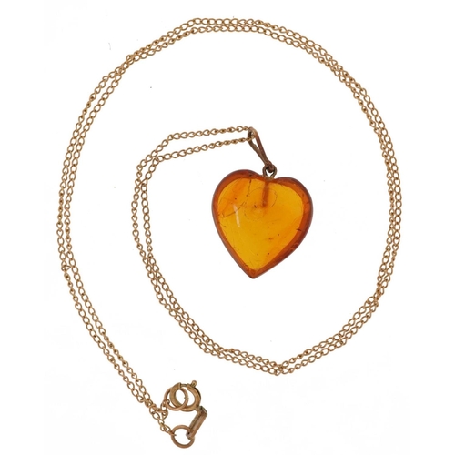 2088 - Natural amber love heart pendant on a 9ct gold necklace, 2cm high and 44cm in length, total 2.0g