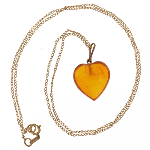 2088 - Natural amber love heart pendant on a 9ct gold necklace, 2cm high and 44cm in length, total 2.0g