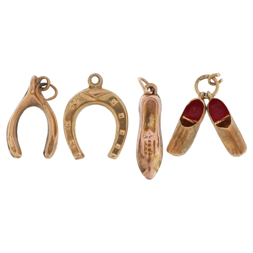 2520 - Four gold charms comprising pair of 14ct and enamel Dutch clogs, 9ct gold lucky horseshoe, 9ct gold ... 