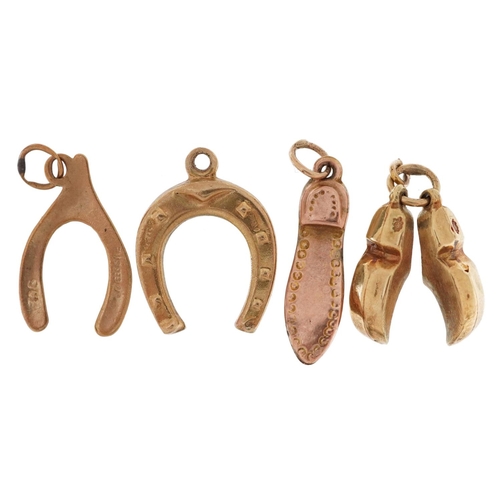 2520 - Four gold charms comprising pair of 14ct and enamel Dutch clogs, 9ct gold lucky horseshoe, 9ct gold ... 