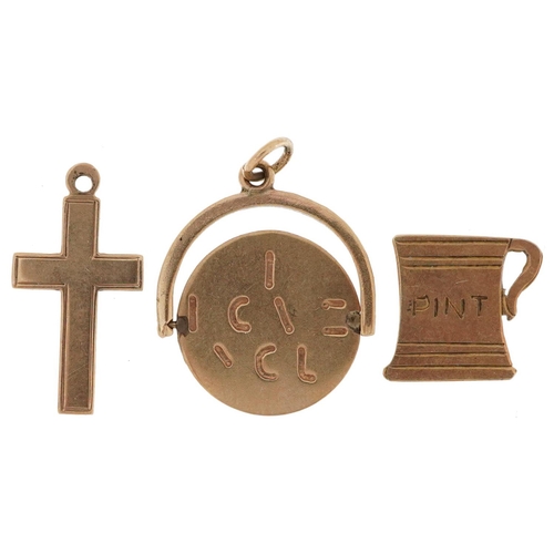 2584 - Three 9ct gold charms comprising I Love You spinner, pint tankard and cross, the largest 1.7cm high,... 