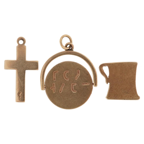 2584 - Three 9ct gold charms comprising I Love You spinner, pint tankard and cross, the largest 1.7cm high,... 