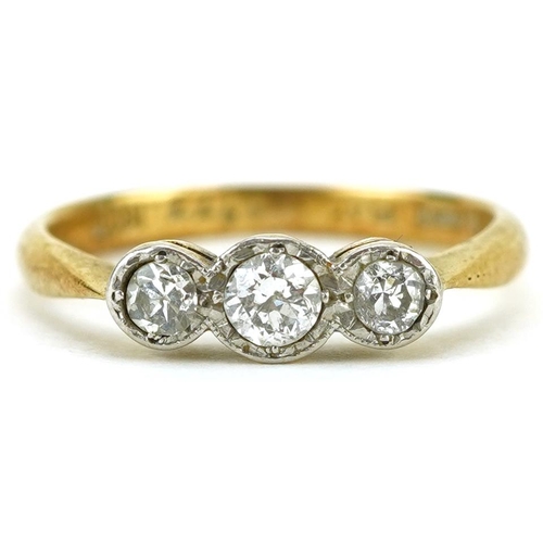 2108 - 18ct gold and platinum diamond three stone ring, the central diamond approximately 0.15 carat, size ... 