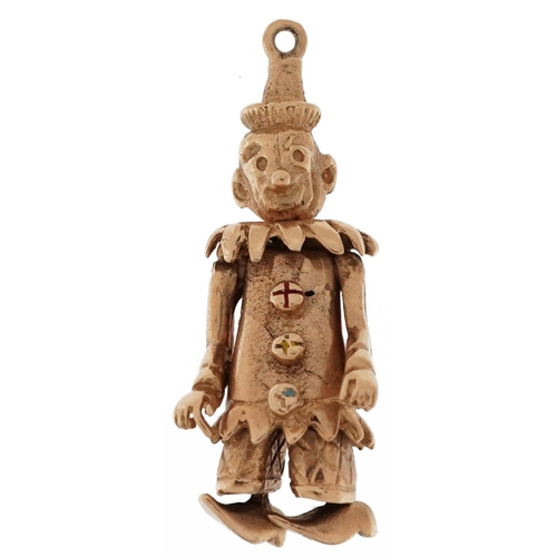 2165 - 9ct gold charm in the form of a clown with articulated limbs, 3cm high, 5.4g