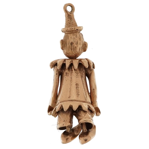 2165 - 9ct gold charm in the form of a clown with articulated limbs, 3cm high, 5.4g