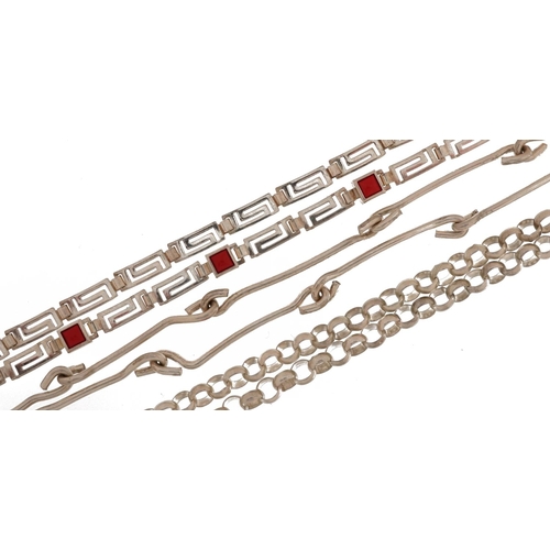 2536 - Two silver necklaces and a white metal necklace, one set with pink coral, the largest 60cm in length... 