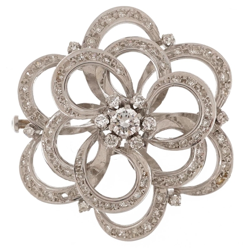  18ct white gold diamond four tier open flower head brooch, the central diamond approximately 0.25ct,... 