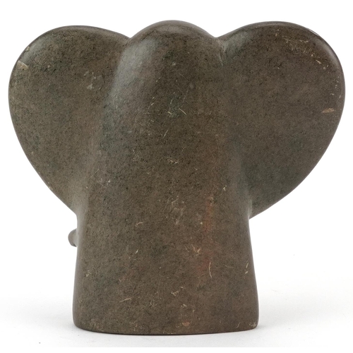 1332 - Modernist stone carving of an elephant incised Charles Tendai to the base, 11.5cm high