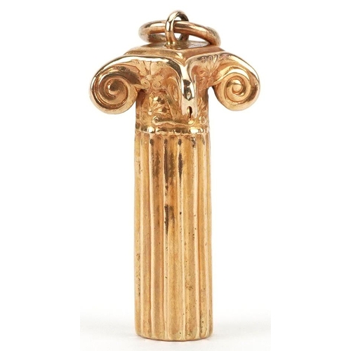 2429 - 18ct gold charm in the form of a Corinthian column, 2.3cm high, 1.6g