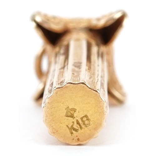 2429 - 18ct gold charm in the form of a Corinthian column, 2.3cm high, 1.6g