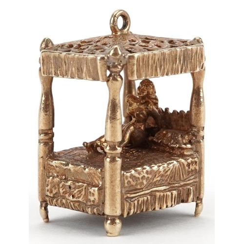 2005 - Large 9ct gold charm in the form of a nude female on a four poster bed, 2.4cm high, 12.2g