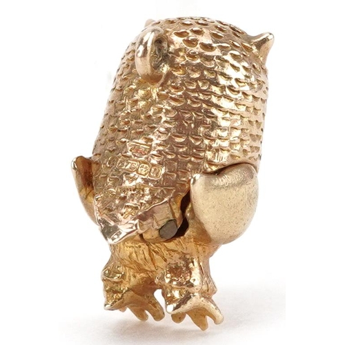 2040 - 9ct gold charm in the form of an owl with hinged head, 1.7cm high, 3.5g