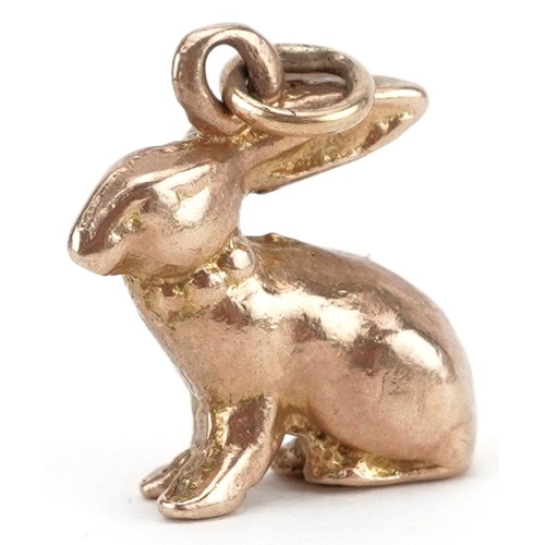 2045 - Unmarked gold charm in the form of a seated rabbit, tests as 9ct gold, 1.4cm high, 4.0g