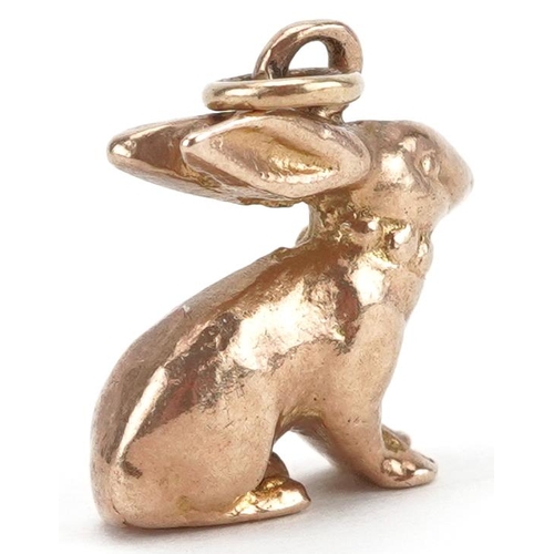 2045 - Unmarked gold charm in the form of a seated rabbit, tests as 9ct gold, 1.4cm high, 4.0g