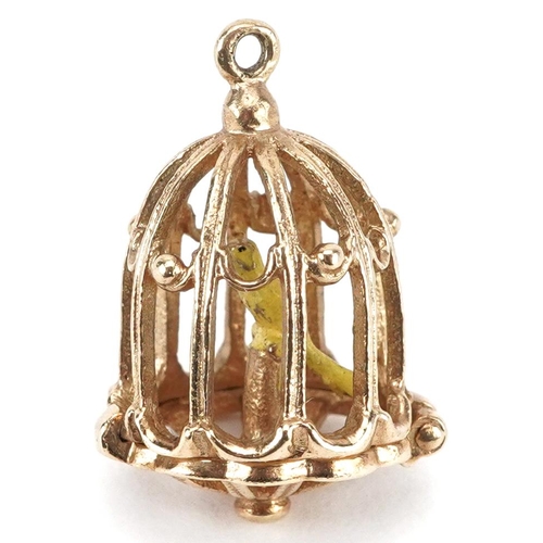 2073 - 9ct gold and enamel opening charm in the form of a bird in a cage, 2.2cm high, 3.6g