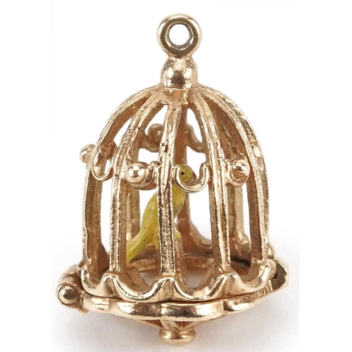 2073 - 9ct gold and enamel opening charm in the form of a bird in a cage, 2.2cm high, 3.6g