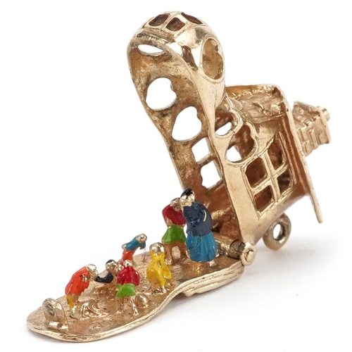 2054 - 9ct gold and enamel opening charm in the form of The Old Woman Who Lived in a Shoe, 3.1cm in length,... 