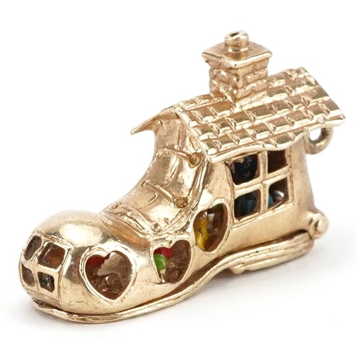 2054 - 9ct gold and enamel opening charm in the form of The Old Woman Who Lived in a Shoe, 3.1cm in length,... 