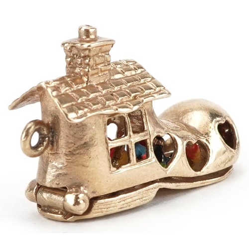 2054 - 9ct gold and enamel opening charm in the form of The Old Woman Who Lived in a Shoe, 3.1cm in length,... 