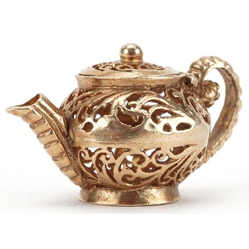 2082 - 9ct gold charm in the form of a teapot with hinged lid, 2.7cm wide, 4.2g