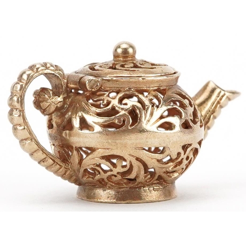 2082 - 9ct gold charm in the form of a teapot with hinged lid, 2.7cm wide, 4.2g