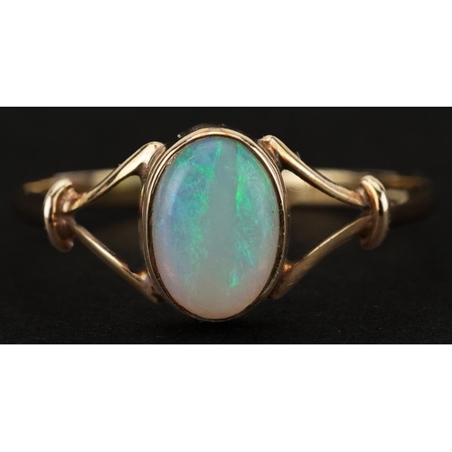 2293 - 9ct gold cabochon opal ring with split shoulders, size N/O, 0.9g