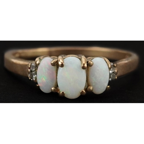 2261 - 9ct gold cabochon opal three stone ring with diamond set shoulders, size P, 1.8g