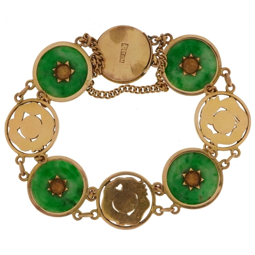 2010 - Chinese 18ct gold bracelet having four inset green jade panels and four panels pierced with dragons,... 