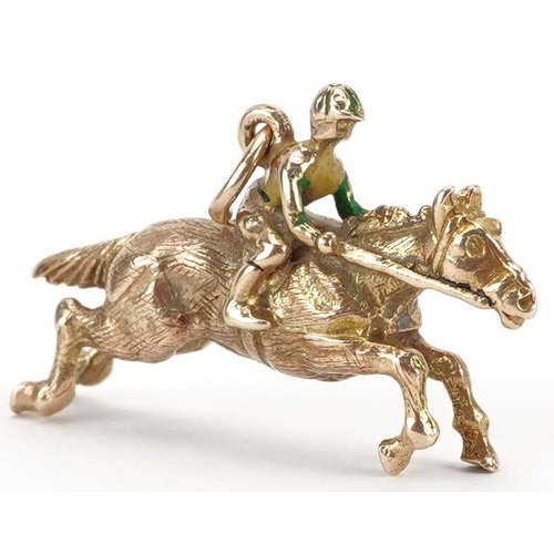 2070 - 9ct gold and enamel charm in the form of a jockey on horseback, 2.9cm wide, 5.0g