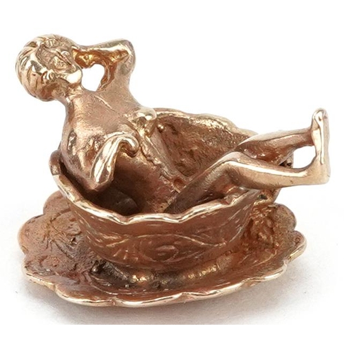 2034 - 9ct gold charm in the form of a nude figure in a cup, engraved You're My Cup of Tea, 2.1cm wide, 6.0... 