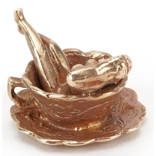 2034 - 9ct gold charm in the form of a nude figure in a cup, engraved You're My Cup of Tea, 2.1cm wide, 6.0... 