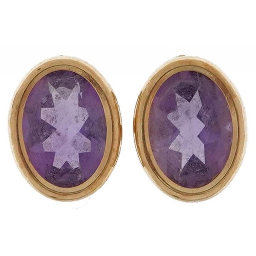 2112 - Pair of 9ct gold amethyst stud earrings, 9mm high, 1.1g