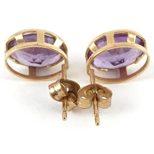 2112 - Pair of 9ct gold amethyst stud earrings, 9mm high, 1.1g