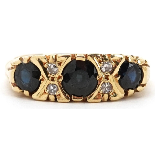 2203 - 18ct gold graduated sapphire and diamond seven stone ring with scrolled setting, size O, 5.8g