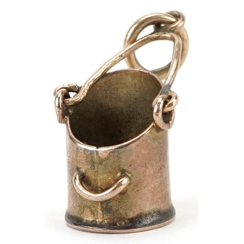 2618 - 9ct gold charm in the form of a coal bucket with swing handle, 1.8cm high, 0.9g