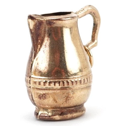 2186 - 9ct gold charm in the form of a water jug, 2cm high, 1.8g