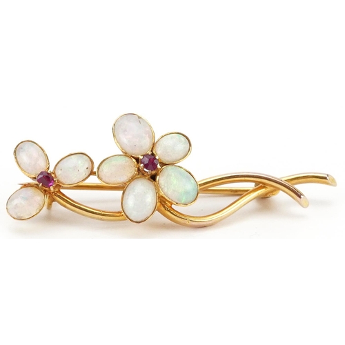 2454 - 9ct gold ruby and opal floral bar brooch, 4.1cm wide, 2.2g