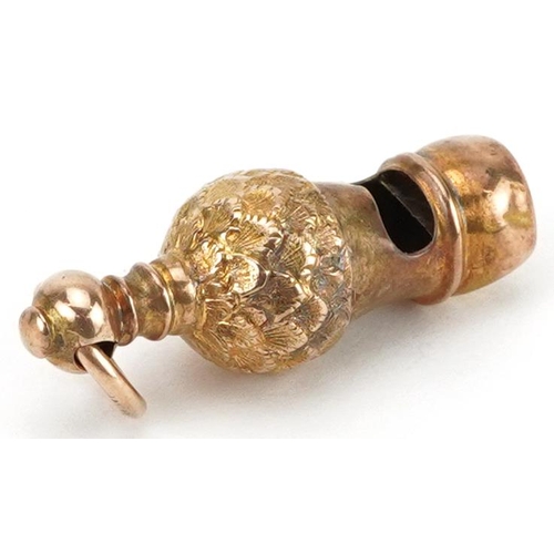 2262 - Unmarked gold charm in the form of a whistle, tests as 9ct gold, 3.2cm high, 3.1g